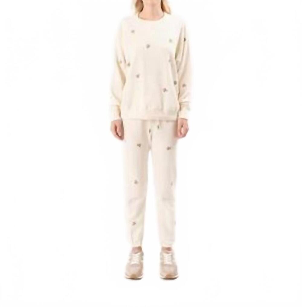 NEW THE GREAT. stadium sweatpant with embroidered roses in washed white